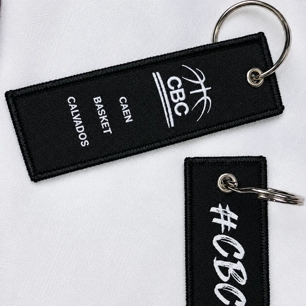 Porte-clé tissé noir et blanc avec logo du CBC